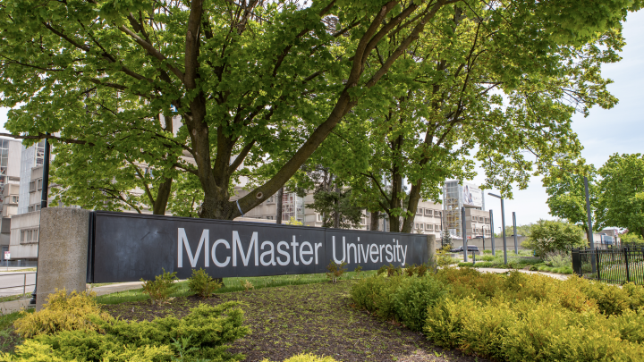 Photo of McMaster Signage in front of trees and shrubs