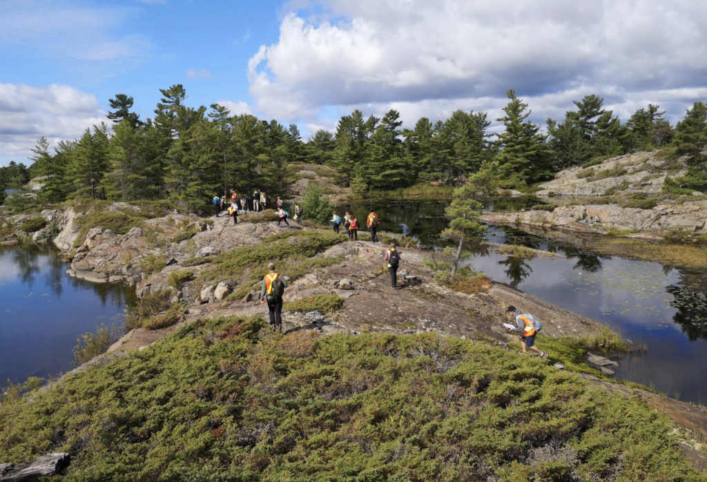 Image of geology students at Whitefish Falls conducting field mapping.