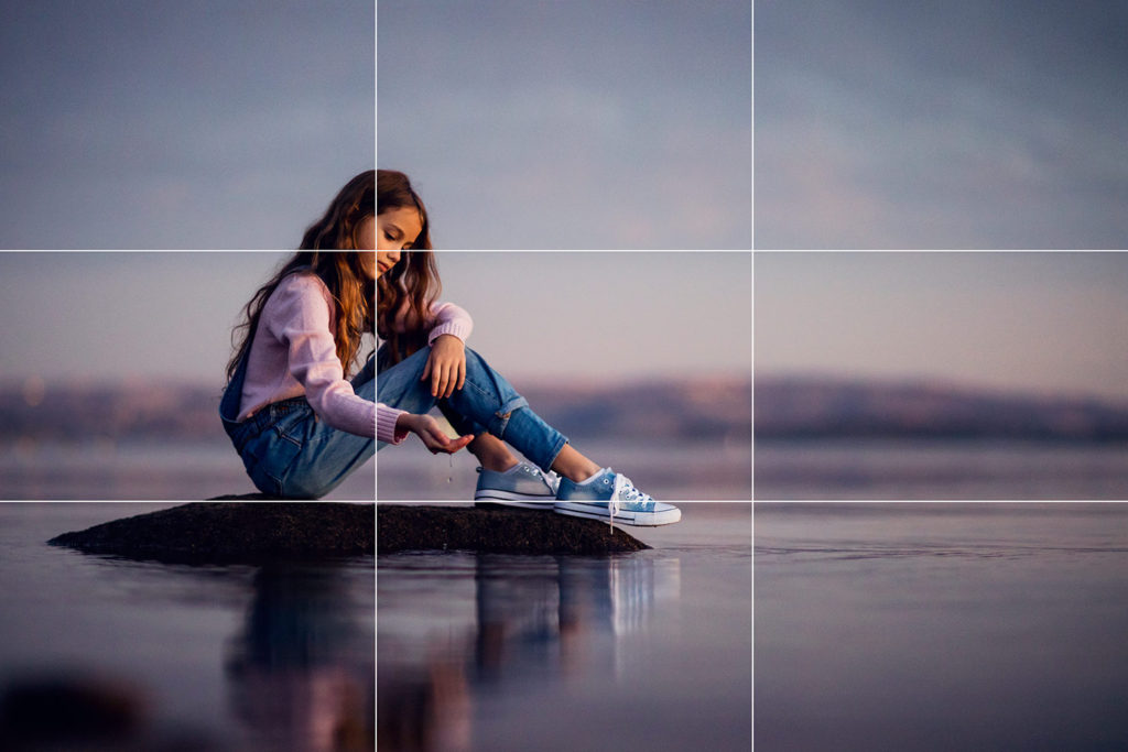 Grid image depicting the concept of image composition. The image features a square grid on top of an image of a girl.