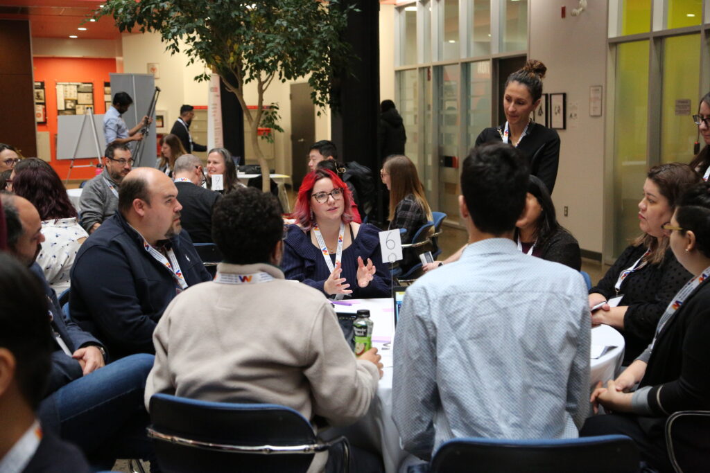 Attendees at the Innovations in Education Conference participate in round table discussions.