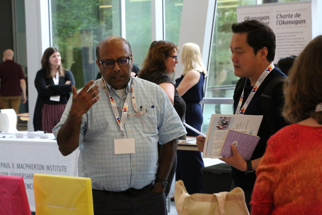 New Faculty Orientation attendees visit the Resource Fair in August 2023.