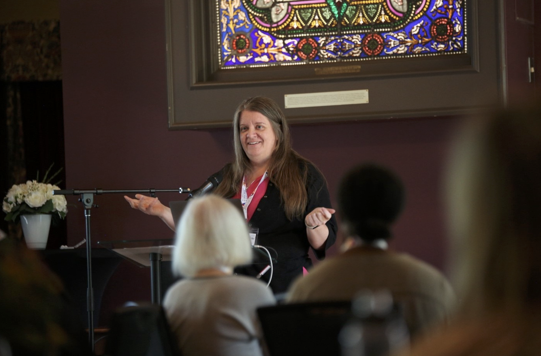 Lori Goff, director of the MacPherson Institute, addresses attendees at the 10-Year Anniversary of the Leadership in Teaching and Learning Fellowship program. 